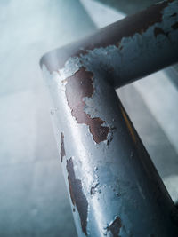 High angle view of rusty metal railing during winter