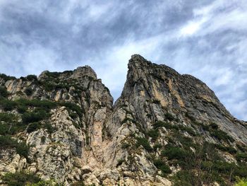 Low angle view of rock formation against sky