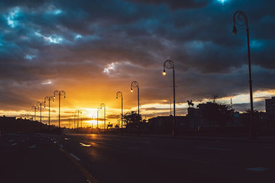 Street against sky during sunset