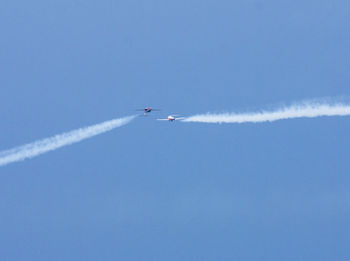 Low angle view of airplane flying in sky