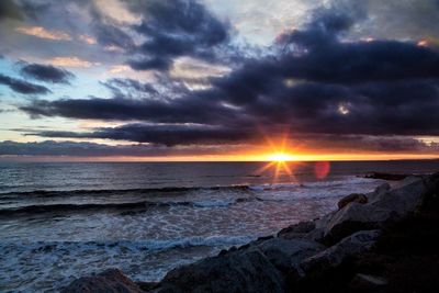 Scenic view of sea against cloudy sky