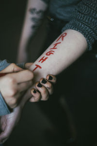 Close-up of man hand on wall