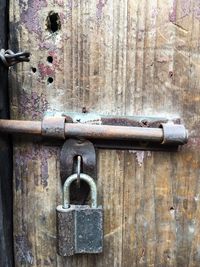 Close-up of padlock on metal door