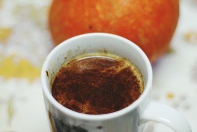 Close-up of coffee cup on table