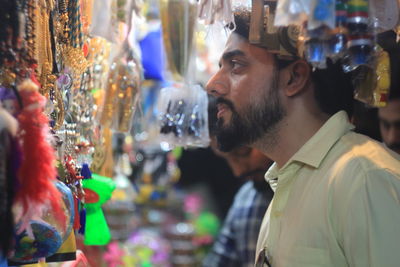 Portrait of man looking at market