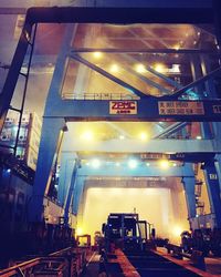 Illuminated train in city at night