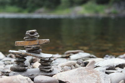 Close-up of pebbles in river