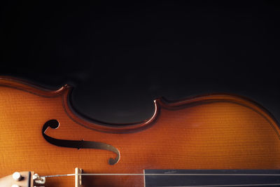 Close-up of two people against black background