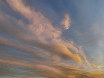 Low angle view of dramatic sky during sunset