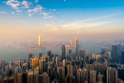 Aerial view of modern buildings in city against sky