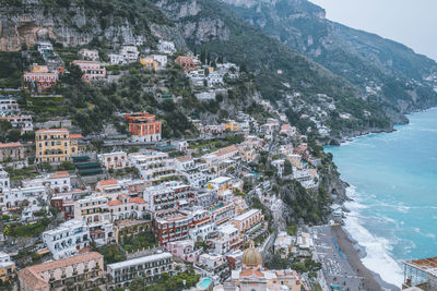 High angle view of townscape by sea