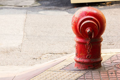 Close-up of fire hydrant on footpath