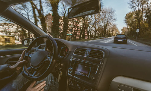 Midsection of man driving car