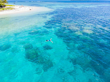 High angle view of person swimming in sea