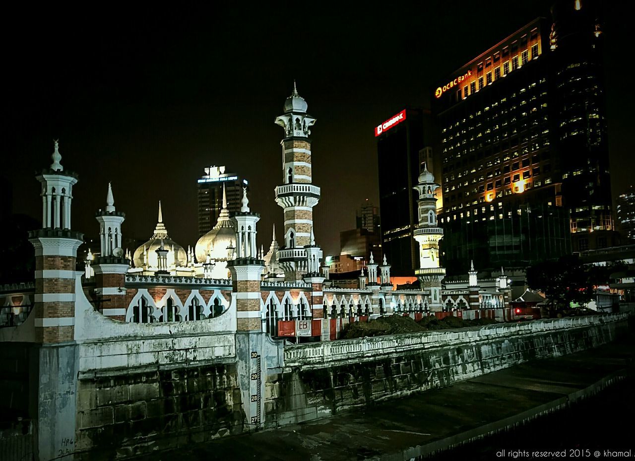 VIEW OF ILLUMINATED BUILDINGS AT NIGHT