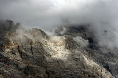 Rocky landscape against clouds