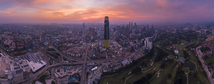 High angle view of buildings against sky during sunset