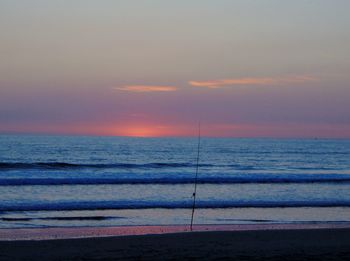 Scenic view of sea against sky at sunset