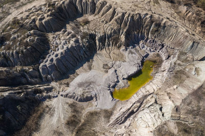 Industrial mining landscape from a drone. aerial view of abandoned open pit mine, nature pollution