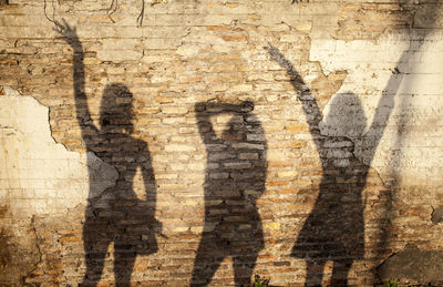 Shadow of man on brick wall