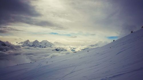 Scenic view of landscape against cloudy sky