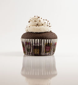 Close-up of cupcakes against white background