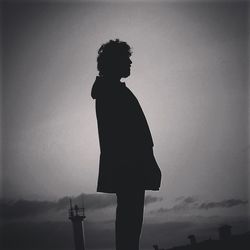 Low angle view of people against sky