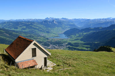 Scenic view of landscape and mountains against sky