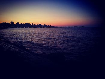 Scenic view of sea against sky at sunset