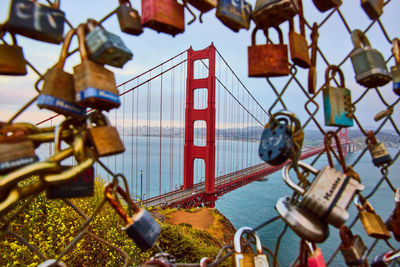 Padlocks hanging on railing