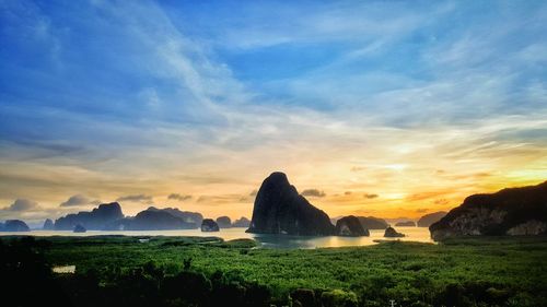 Scenic view of rock formation against sky during sunset