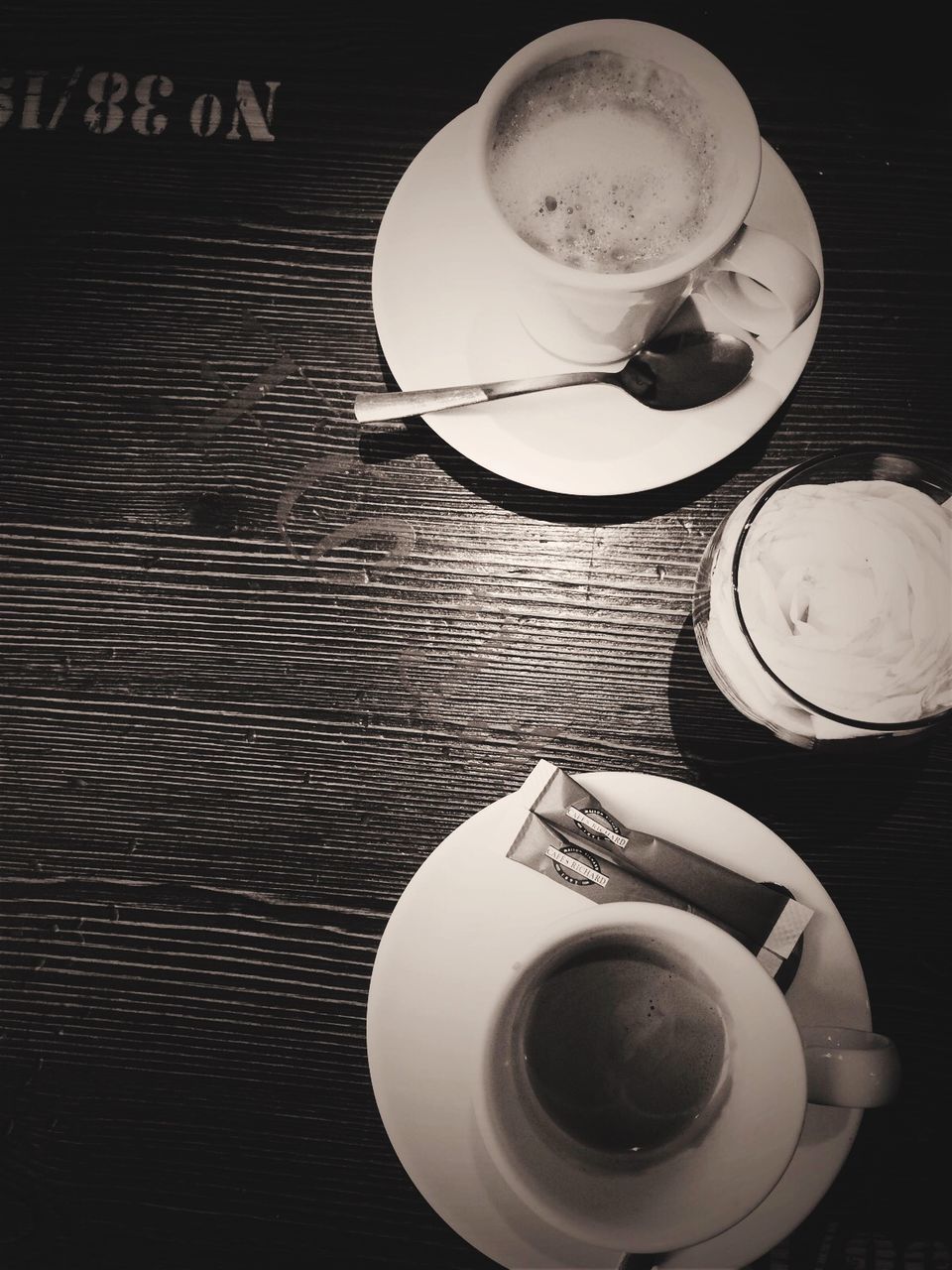 indoors, coffee cup, drink, coffee - drink, table, saucer, food and drink, refreshment, still life, coffee, spoon, cup, close-up, high angle view, directly above, tea cup, plate, freshness, no people, beverage