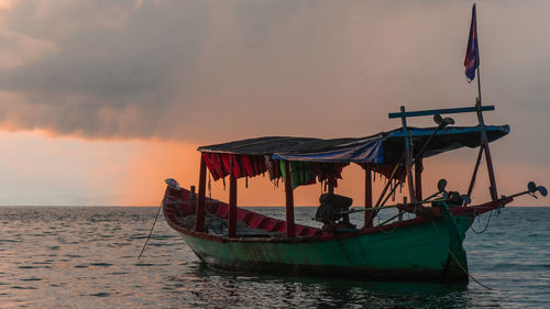 Koh rong island, cambodia at sunrise. strong vibrant colors, boats and ocean