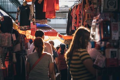 People walking on street market in city