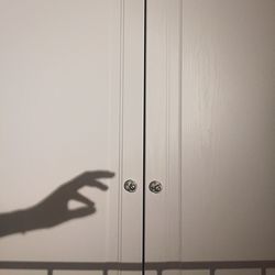Hand shadow on closed door