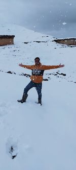 Man on snow covered land during winter