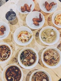 High angle view of various food in bowls on table