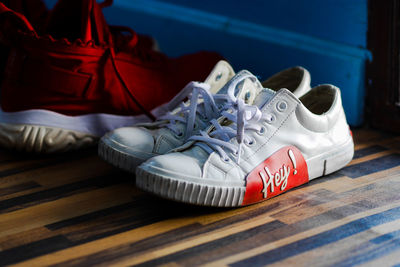Close-up of shoes on hardwood floor