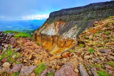 Rock formations on mountain against sky