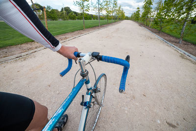 Man riding bicycle on road