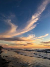 Scenic view of beach against sky during sunset