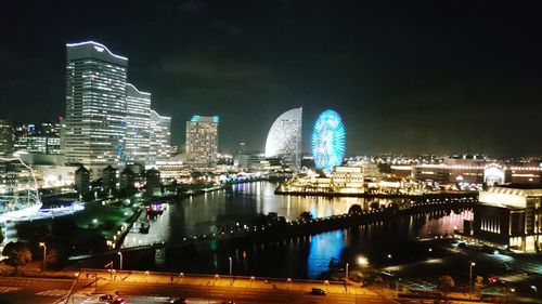 Illuminated buildings in city at night