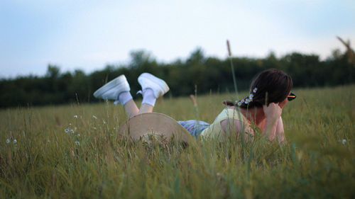 Side view of woman on field