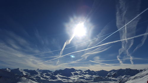 Scenic view of snow covered mountains against sky