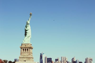 Low angle view of statue of liberty against sky