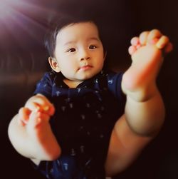 Close-up portrait of cute baby playing