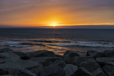 Scenic view of sea against sky during sunset