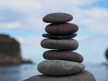 Close-up of stack of pebbles on beach