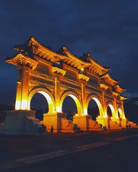 Illuminated city against sky at night