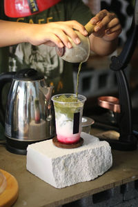 Midsection of woman preparing food on table